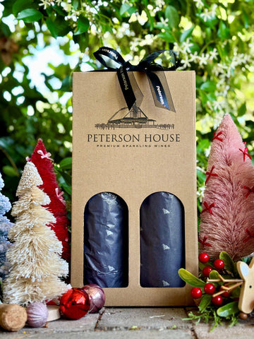 Two bottles of Peterson House wine in a cardboard packaging with Christmas decorations. Mystery gift for fun. affordable hunter valley gift peterson house. 